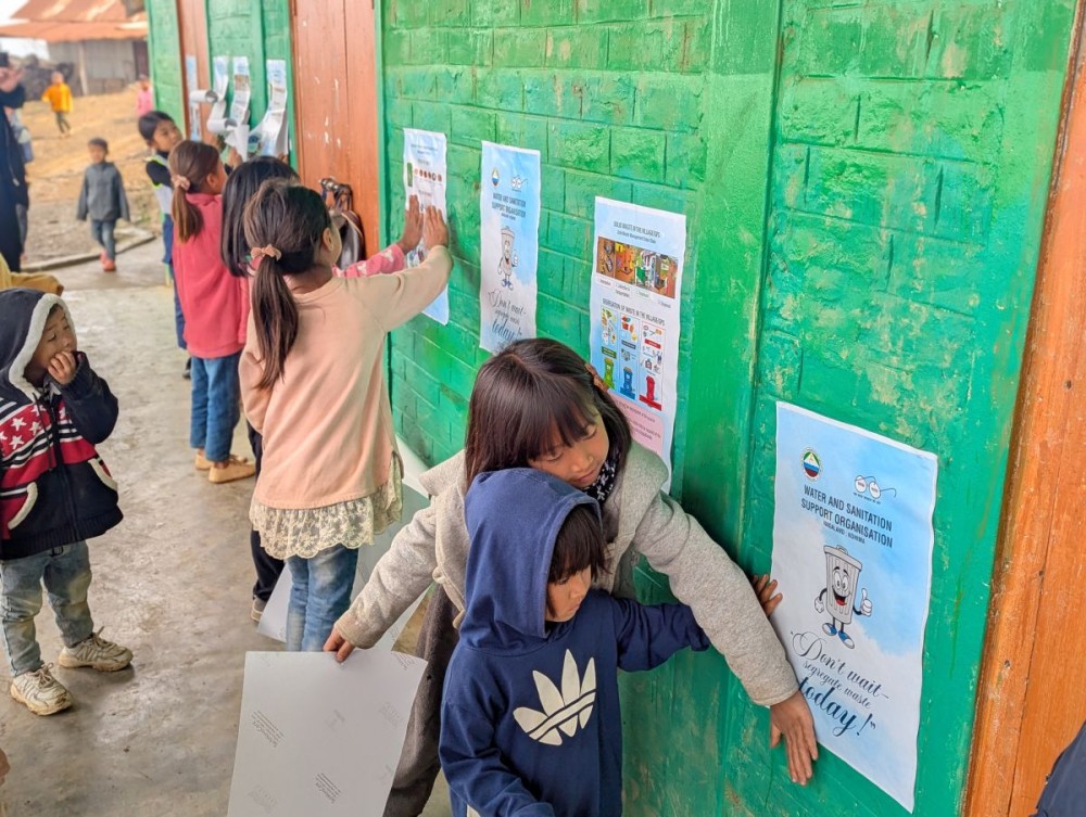 Children participate in putting up sanitation posters at community hall, school and Anganwadi centres.